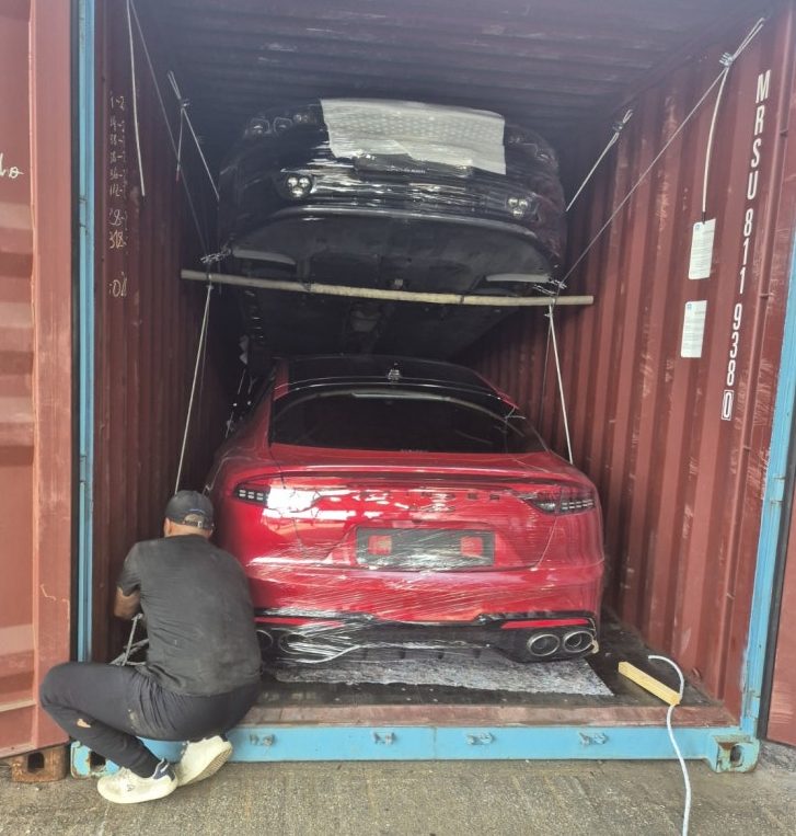 Vehicles secured and loaded inside a container